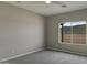 Cozy bedroom featuring views of the natural landscape through the bright window at 22352 W Gamble Ln, Wittmann, AZ 85361