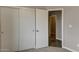 Bedroom features a closet with sliding doors providing ample storage space in neutral modern setting at 22352 W Gamble Ln, Wittmann, AZ 85361