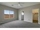 Bedroom featuring a window with a view, light-colored walls and carpet flooring at 22352 W Gamble Ln, Wittmann, AZ 85361