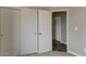 Bedroom features a closet with sliding doors providing ample storage space in neutral modern setting at 22352 W Gamble Ln, Wittmann, AZ 85361