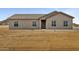 Close-up of the home's exterior featuring a well-maintained facade and a neat walkway at 22352 W Gamble Ln, Wittmann, AZ 85361