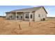 New single Gathering home featuring a covered patio, desert landscape and neutral colors at 22352 W Gamble Ln, Wittmann, AZ 85361