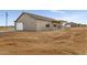 New single Gathering home featuring a two-car garage, patio and desert landscape at 22352 W Gamble Ln, Wittmann, AZ 85361