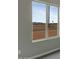 An expansive view through a window looking out to the vast desert landscape and beautiful blue sky at 22352 W Gamble Ln, Wittmann, AZ 85361