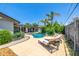 Backyard featuring a sparkling pool, lounge chairs, and well-maintained landscaping at 253 N Fraser Dr, Mesa, AZ 85203