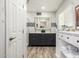 Bathroom featuring double vanity, subway tile, and modern fixtures at 253 N Fraser Dr, Mesa, AZ 85203