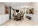 Bright dining room with large table, comfortable seating, and wall-mounted television at 253 N Fraser Dr, Mesa, AZ 85203