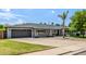 Inviting single-story home with a covered front porch and a two-car garage at 253 N Fraser Dr, Mesa, AZ 85203