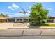 Charming single-story home with a well-maintained yard and attached two-car garage at 253 N Fraser Dr, Mesa, AZ 85203