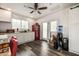 The kitchen offers white cabinets, counter space, and a red retro refrigerator at 253 N Fraser Dr, Mesa, AZ 85203