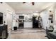 This kitchen features white cabinets, a black fridge, and a stainless steel range at 253 N Fraser Dr, Mesa, AZ 85203