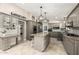Spacious kitchen featuring granite countertops, pendant lighting, and stainless steel appliances at 253 N Fraser Dr, Mesa, AZ 85203