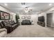 Comfortable living room with neutral carpet, ceiling fan, and a flat screen TV at 253 N Fraser Dr, Mesa, AZ 85203