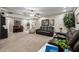 Spacious living room with neutral carpet, a piano, and comfortable furniture at 253 N Fraser Dr, Mesa, AZ 85203
