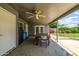 Covered patio is great for outdoor dining and has a ceiling fan and ample light at 253 N Fraser Dr, Mesa, AZ 85203