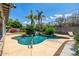 Refreshing pool area surrounded by lush landscaping and a charming waterfall feature at 253 N Fraser Dr, Mesa, AZ 85203