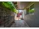 Exterior side yard featuring block fencing and access to laundry appliances at 253 N Fraser Dr, Mesa, AZ 85203