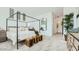 Serene main bedroom with a stylish bed, decorative accents, and ample natural light, creating a peaceful retreat at 2877 E Lucky Horseshoe Ln, San Tan Valley, AZ 85140