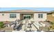 Cozy outdoor patio space with comfortable seating arrangements, perfect for relaxing and entertaining at 2877 E Lucky Horseshoe Ln, San Tan Valley, AZ 85140