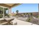 Inviting outdoor patio area perfect for relaxing and entertaining, featuring stylish furniture and serene landscaping at 2877 E Lucky Horseshoe Ln, San Tan Valley, AZ 85140