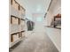 Walk-in closet featuring shelving, ample storage space, and carpet floors at 2877 E Lucky Horseshoe Ln, San Tan Valley, AZ 85140