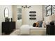 Modern bedroom featuring bed with decorative pillows, sleek black dresser, and artful wall accents at 2897 E Lucky Horseshoe Ln, San Tan Valley, AZ 85140