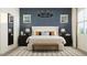 Stylish bedroom with elegant decor, textured wall, and ample natural light at 2897 E Lucky Horseshoe Ln, San Tan Valley, AZ 85140