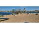 Inviting community playground by a pond, featuring picnic benches and play structures for Gathering enjoyment at 2897 E Lucky Horseshoe Ln, San Tan Valley, AZ 85140