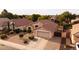 Aerial view showcasing the home's layout, desert landscaping, and convenient garage access at 300 W Cardinal Way, Chandler, AZ 85286