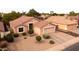 Single-story home with well-manicured landscaping and neutral stucco, offering great curb appeal at 300 W Cardinal Way, Chandler, AZ 85286