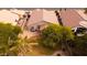 Residential backyard featuring a grass area, desert landscaping, and comfortable patio seating at 300 W Cardinal Way, Chandler, AZ 85286