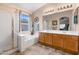 Bathroom features a separate tub, shower, and double sink vanity at 300 W Cardinal Way, Chandler, AZ 85286