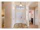 Inviting foyer featuring tile flooring, high ceilings, and views of bathroom and laundry room at 300 W Cardinal Way, Chandler, AZ 85286