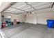 Spacious garage featuring storage shelves, a utility sink, and ample room for parking at 300 W Cardinal Way, Chandler, AZ 85286
