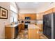 Updated kitchen with stainless appliances, oak cabinets, island and plenty of counter space at 300 W Cardinal Way, Chandler, AZ 85286