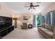 Comfortable living room with plush carpeting, and a cozy seating area with ample natural light at 300 W Cardinal Way, Chandler, AZ 85286