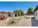 Expansive backyard with brick fire pit and storage shed, offers plenty of potential at 3001 N 21St Ave, Phoenix, AZ 85015