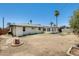Backyard view showcasing ample space, a privacy fence, and the home's exterior at 3001 N 21St Ave, Phoenix, AZ 85015