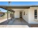 Spacious covered carport area with a view of the side yard and a brick accent wall at 3001 N 21St Ave, Phoenix, AZ 85015