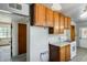 Kitchen showcasing the cabinets and appliances alongside a view to the door and hallway at 3001 N 21St Ave, Phoenix, AZ 85015