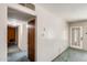 A view to the front door and hallway from inside the living room. Carpeted flooring at 3001 N 21St Ave, Phoenix, AZ 85015