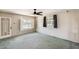 Bright living room featuring large windows, ceiling fan, and neutral-toned walls at 3001 N 21St Ave, Phoenix, AZ 85015