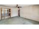 Bright living room with a ceiling fan and an open doorway leading to another room at 3001 N 21St Ave, Phoenix, AZ 85015