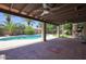 Spacious covered patio overlooking a pool, providing an ideal space for outdoor entertaining and relaxation at 3009 W Christy Dr, Phoenix, AZ 85029
