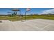 Community basketball court, green space, playground, and houses in a Gathering friendly community at 3139 E Barrel Race Rd, San Tan Valley, AZ 85140