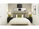 Cozy bedroom featuring a bed with pillows, neutral walls, two night stands, and stylish light fixtures at 3139 E Barrel Race Rd, San Tan Valley, AZ 85140