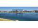 Community lake with a covered seating area, walking trails, and desert landscaping at 3139 E Barrel Race Rd, San Tan Valley, AZ 85140