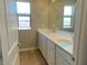 Bathroom featuring dual sinks, ample counter space, and modern fixtures for comfortable living at 31878 N Bandit Rd, San Tan Valley, AZ 85143
