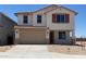 Charming two-story home with a two car garage, landscaped yard, and classic shutters at 31878 N Bandit Rd, San Tan Valley, AZ 85143