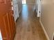 Inviting hallway featuring sleek, modern flooring and neutral walls for a bright, open feel at 31878 N Bandit Rd, San Tan Valley, AZ 85143